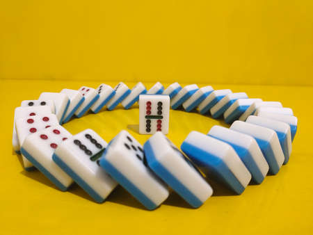 Medan, Indonesia - January 13, 2021: Dominoes On Yellow Background, Medan City, Indonesia.の写真素材