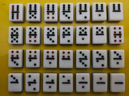 Medan, Indonesia - January 13, 2021: Dominoes On Yellow Background, Medan City, Indonesia.の写真素材