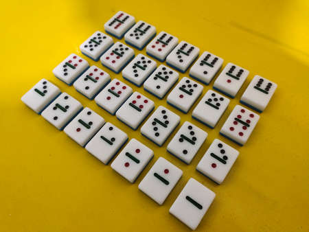 Medan, Indonesia - January 13, 2021: Dominoes On Yellow Background, Medan City, Indonesia.