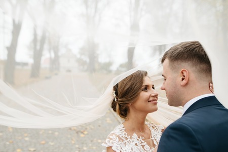 Cute bride couple spend time together after the wedding ceremonyの写真素材