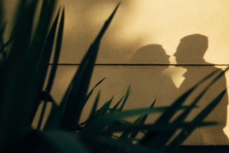 A young, sympathetic couple walks through the streets of the city. Loveの写真素材
