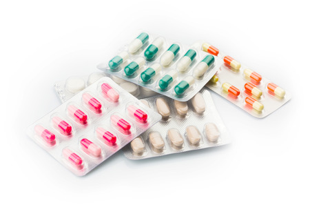 Various pills  and Capsules on the White Surfaceの写真素材