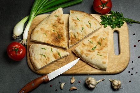 Fresh homemade pita with tomatoes and spices. Cooking conceptの写真素材