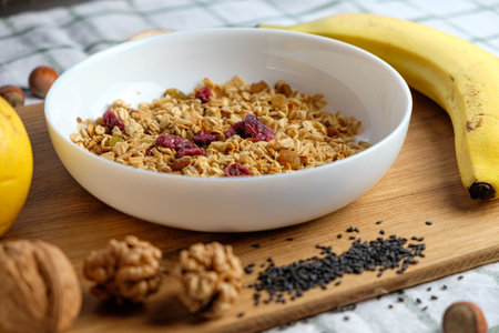 Homemade granola with nuts, raisins and dried cranberriesの写真素材