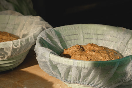Freshly prepared dough resting in woven baskets, ready for the art of baking in a warm kitchen...