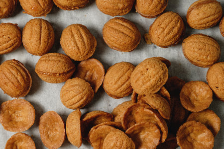 Delightful assortment of freshly baked nut-shaped cookies laid out on a rustic table capturing the...