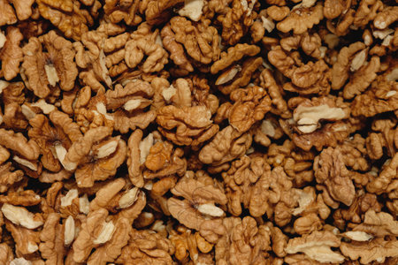 Nutty abundance showcases the rich texture and earthy tones of shelled walnuts ready for culinary...