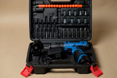 Versatile tool case with cordless drill and home repair essentialsの写真素材