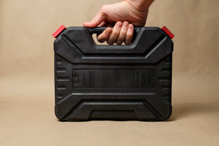 Convenient black tool case for home repairs and construction tasksの写真素材