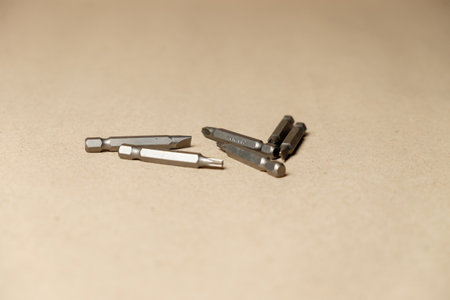 Essential tools for home repair with a focus on drill bits and fastenersの写真素材