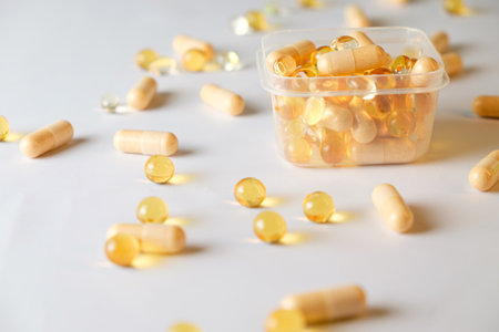 Scattered capsules reveal vibrant colors in a tranquil settingの写真素材