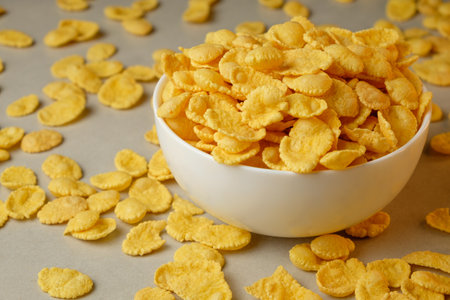 Breakfast bowl overflowing with golden corn flakes on a sunny morning