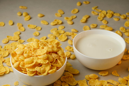 Crunchy corn flakes ready to be enjoyed with chilled milk on a sunny morningの写真素材