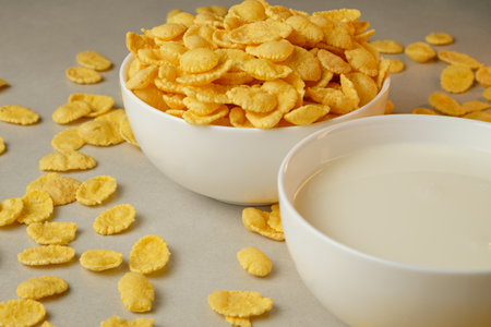 Enjoying crunchy corn flakes and milk on a sunny morningの写真素材