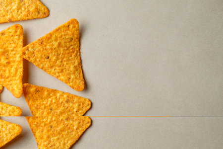 Flavorful nacho chips arranged artfully against a soft backgroundの写真素材