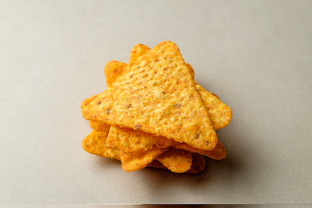 Crunchy nacho chips stacked together, ready for dipping and sharingの写真素材
