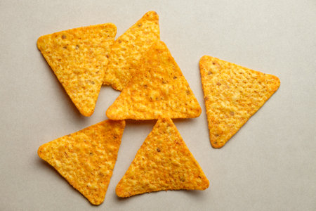 Crunchy triangle chips create a delightful snack experience and party favoriteの写真素材