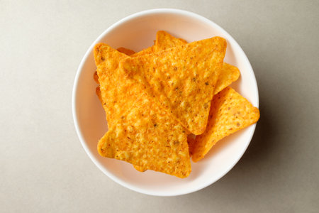 Crunchy snack bowl filled with nacho chips ready for a fiesta nightの写真素材