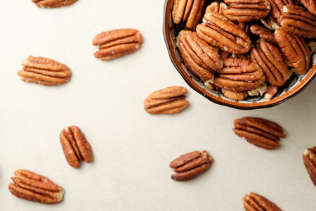 Delightful pecan nuts arranged artistically for a savory snack experienceの写真素材