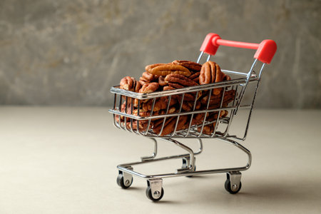 Shopping cart filled with fresh pecan nuts in a rustic kitchen settingの写真素材