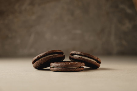 Delicious chocolate cookies stacked on a smooth countertop at cozy kitchenの写真素材