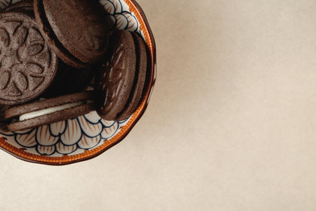 Delicious chocolate cookies in a colorful bowl ready for enjoymentの写真素材