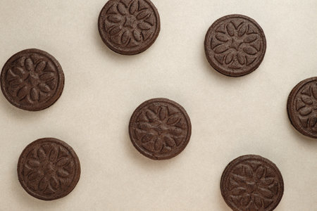 Delightful round chocolate cookies displayed on a soft surfaceの写真素材