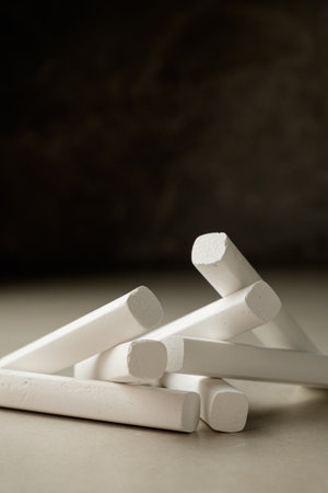 Artistic arrangement of white chalk pieces on a simple surface