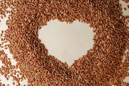 Heart-shaped brown rice on a soft surface showing love for nature