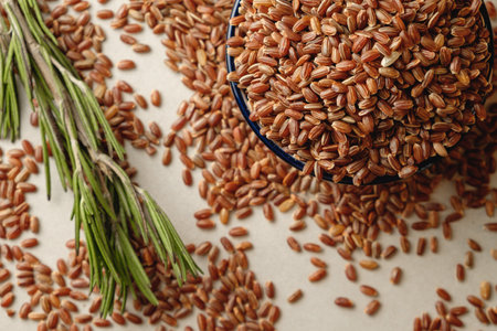 Organic brown rice abundance on a rustic kitchen countertopの写真素材