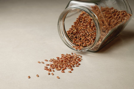 Discovering the rich texture and color of organic brown rice on a rustic surfaceの写真素材