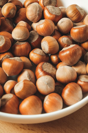 Harvested hazelnuts ready for roasting and baking in cozy kitchen setupの写真素材