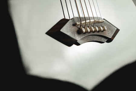 Strings of harmony resonate softly in a cozy indoor spaceの写真素材