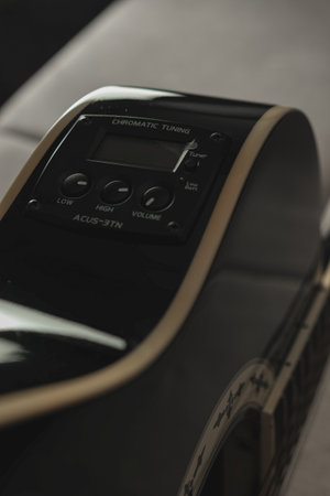 Discovering the beauty of sound with a well-tuned acoustic guitarの写真素材