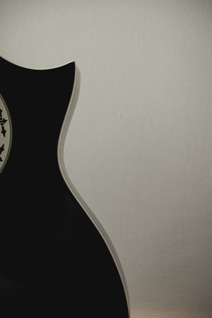 Guitar silhouette against a soft background inspires musical creativity