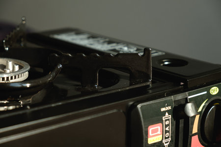 Exploring the details of a sleek black gas stove in a modern kitchen setupの写真素材