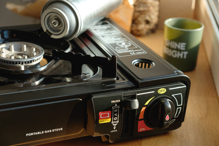Portable gas stove ready for a cozy cooking adventure at homeの写真素材