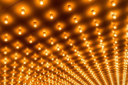 Picture of theater marquee lights with rows of lightbulbs on a theatre entrance. Also commonly known as casino and broadway lights.のeditorial素材