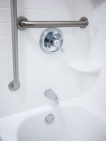 Handicapped disabled access bathroom shower bathtub with grab barsの写真素材