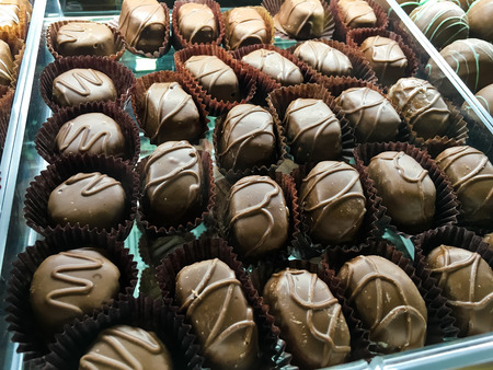 Assorted Chocolate Candies in Display Caseの写真素材