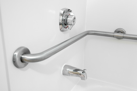 Disabled Access Bathtub Grab Bar Handrail in a Hotel Bathroomの写真素材