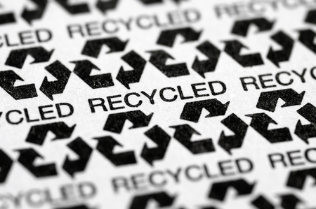 Stock picture of a macro pattern of the recycled / recycling paper symbol labelの写真素材