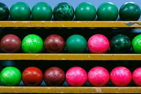 Picture of bowling balls in a ball rackの写真素材