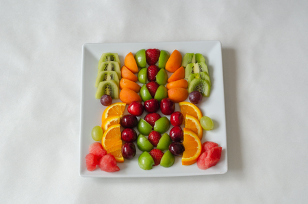 Fresh colorful fruits.  Healthy nutrition, diet concept.Sliced are plums, apricots, kiwi, grapes,...
