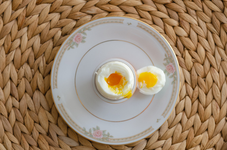Boiled egg for breakfast in a eggcup.Top view.の写真素材