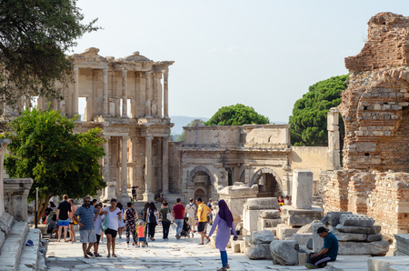 EPHESUS, TURKEY - AUGUST 19, 2018: Tourists are visiting Ephesus. (Library of Celsus in the ancient city of Ephesus, Turkey. Ephesus is a UNESCO World Heritage site.)のeditorial素材