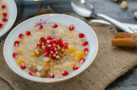 Traditional Turkish dessert Asure or Ashure from the boiled cereals with dried fruits and pomegranate grainsの写真素材