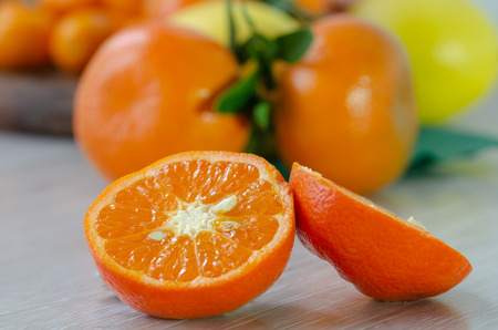 Mandarine orange or tangerine on wooden boardの写真素材