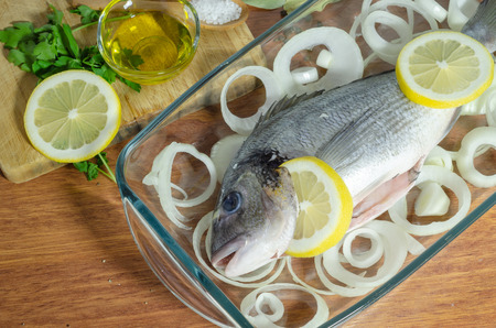Raw sea bass fish . Sea bass ready to be cooked