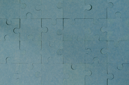 Finished blue  jigsaw puzzle  with copy space. Business strategy teamwork and problem solving concept.の写真素材